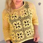 Rose Sweater Front View – A stylish crochet sweater featuring a lovely openwork pattern.
