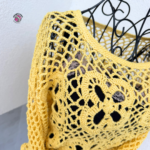 Rose Crochet Sweater Details – Close-up of delicate stitches, lace texture, and granny square connections.